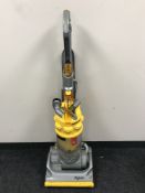 A Dyson DC 14 upright vac cleaner