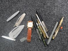 A collection of pens - some with gold nibs - pen knives,