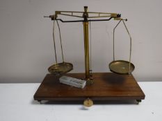 A set of early 20th century chemist's balance scales and weights