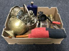 A box of assorted metal ware, field glasses, vintage mincer,