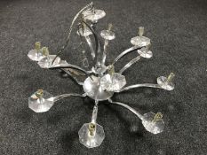 A contemporary twelve branch chandelier