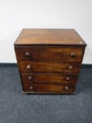 A Victorian inlaid mahogany cabinet with the form of a chest