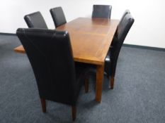 A pine extending dining table with leaf and six high backed leather chairs