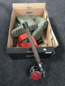 A set of fishing waders together with a part fishing rod with a Pen 113R multiplier reel