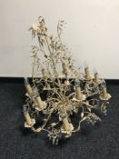 A decorative metal twelve branch chandelier