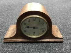 An early 20th century oak mantel clock