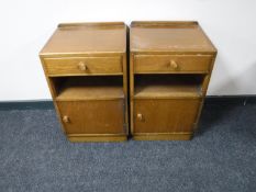 A pair of mid 20th century oak bedside cabinets