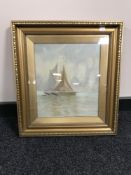 An early 20th century gilt framed oil on board depicting a sail boat