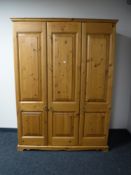 A pine triple door wardrobe