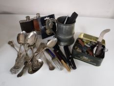 A box containing plated cutlery, collection of assorted wristwatches, hip flasks,