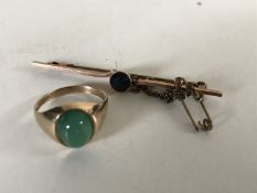 A 9ct gold dress ring and a sapphire bar brooch