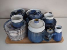 A quantity of Denby Chatsworth tea and dinner ware with matching cutlery together with a Denby tea