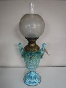 A Victorian glazed pottery oil lamp with chimney and shade CONDITION REPORT: Shade