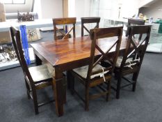 A hardwood dining table and six chairs