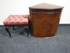 A mahogany corner cabinet and dressing table stool
