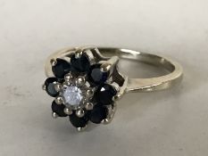 A 14ct gold diamond and sapphire cluster ring,
