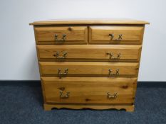 A pine five drawer chest