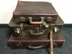 Three vintage leather luggage cases