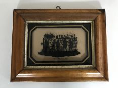 A walnut framed silhouette 'The Pedlars'