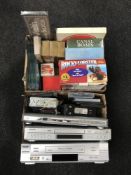 Three boxes containing DVD players and VCR's, car radios, place mats,