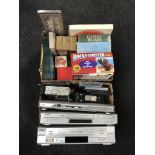 Three boxes containing DVD players and VCR's, car radios, place mats,
