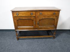 A 20th century oak sideboard