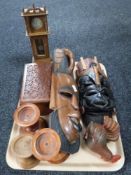 A tray of miniature oak Grandfather clock, wooden candle holders,