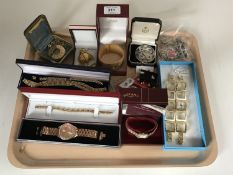 A tray of silver and costume jewellery, fob watches,