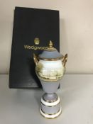 A Wedgwood twin handled lidded vase, painted with views of Chatsworth House by M.