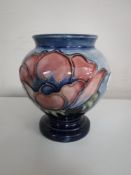 A Moorcroft blue glazed vase,