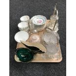 A mid 20th century 6 1/2 gallon glass bottle together with a tray containing bone china tea wares,