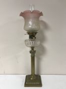 A Victorian glass oil lamp with clear glass reservoir CONDITION REPORT: Shade with