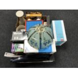 Two boxes containing candle holders, alarm clocks, cool box, wheel trims,