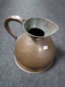 A 19th century copper two gallon jug