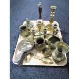 A tray of brass ware, candlesticks, bellows,