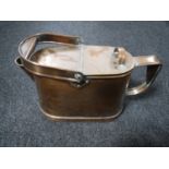 An antique copper watering can