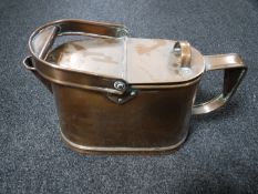 An antique copper watering can
