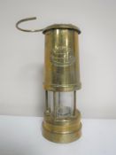 A Lamp and Limelight brass miner's lamp