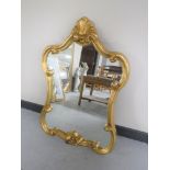 An ornate gilded framed mirror
