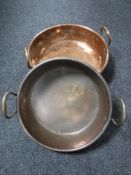 Two copper twin handled cooking pots
