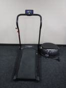 A Confidence Fitness electric treadmill and a Vibra Power disc vibration plate