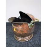A Victorian copper coal bucket with brass handle