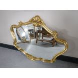 An ornate gilded framed mirror