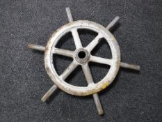 A cast metal ship's wheel