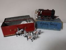 A Hornby Series clockwork tin plate locomotive and a tin of mid 20th century painted lead soldiers