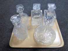 A tray containing five assorted decanters