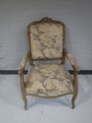 An antique tapestry armchair