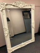 A large Victorian style white painted bevelled mirror,
