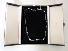 An 18ct white gold diamond set necklace,