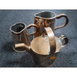 Two Victorian copper jugs and a copper watering can